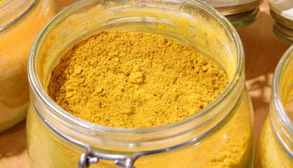 Fototapeta na wymiar jar with curry powder for sale