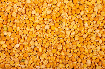 Yellow split peas, the texture of the surface. Traditional cereals for making soups and porridge. Close up.