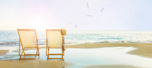 Background with couple of deck chairs at sunset, Travel concept, Summer background