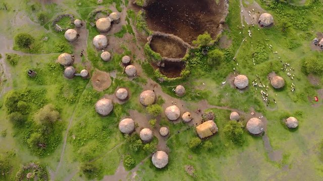 Aerial Drone Shot. Traditional Masai village at Sunset time near Arusha, Tanzania.