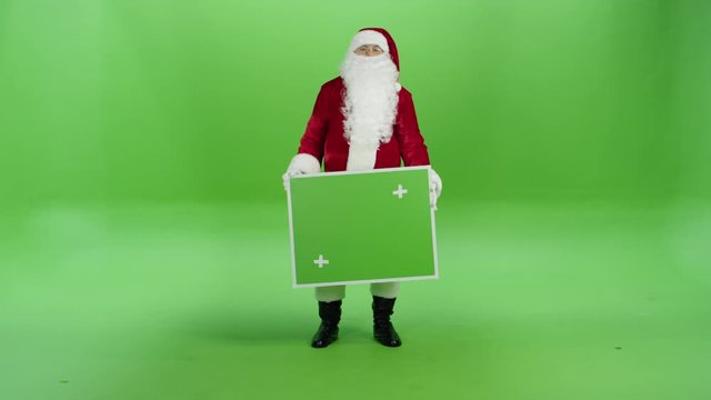Father Christmas or Santa Claus on a green background
