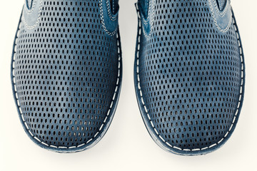 Men's blue shoes on a white isolated background