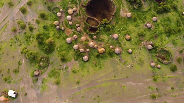Aerial Drone Shot. Traditional Masai village at Sunset time near Arusha, Tanzania.