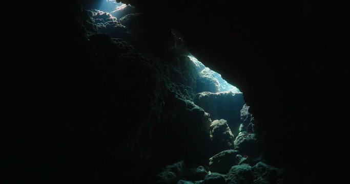 caves tunnels swimthroughs underwater for scuba divers to explore with nice lightning sun beams and rays ovean scenery