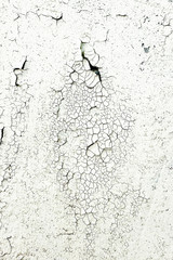 Background with cracks on the wall, peeling paint in heaps. Cracks are similar to cracks in dry land during a drought. Texture to overlay. On a white background.