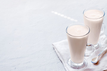 Two fermented drink baked milk ryazhenka kefir glass with immune boosting properties white grey background with copy space