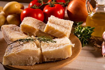 salted codfish on the wooden table with ingredients. Codfish raw.