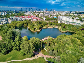 Fototapeta A beautiful panoramic view of the sunset in a fabulous evening on Szczesliwice Park - a former village, currently a housing estate in the Ochota district in Warsaw, Poland obraz