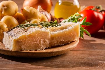 salted codfish on the wooden table with ingredients. Codfish raw.