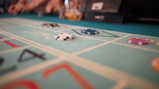 Stacks of chips are on the table in the casino