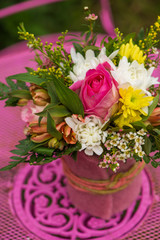 Colorful flower bouquet on a garden table