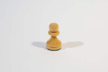 Chess pawn on the white background. 
