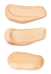 Liquid foundation cream swatch smear. Light beige makeup concealer stroke isolated on white background with clipping path included without shadows.  Nude makeup base swipe