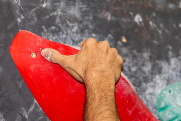 hand climbing on a rock wall