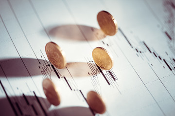 Euro coin on stock chart. Selective focus.