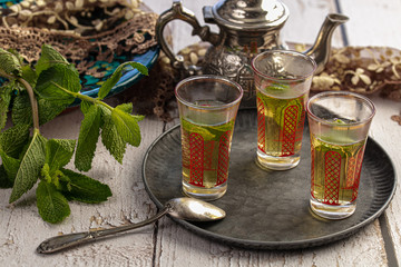 Glasses of mint tea on a tray