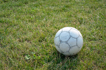 A close up of a football ball on a field