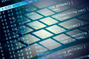 Computer keyboard and program data. Small depth of field.