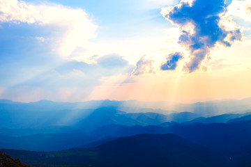 Sinset in summer mountains.