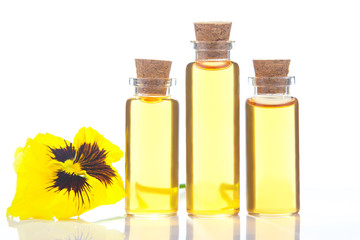 pansies essential oil in  beautiful bottle on  White background