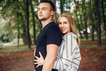 Couple in a forest, warm summer, lovely weather