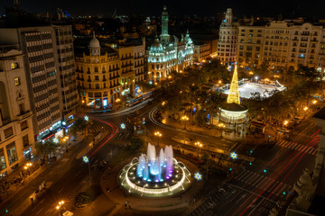 Fototapeta na wymiar Aerial view of the main square of Valencia at night, The Plaza del Ayuntamiento, Spain