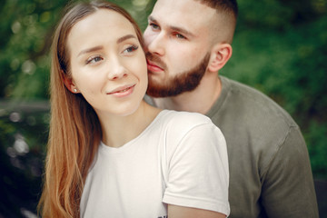 Couple in a forest. Man in a green t-shirt