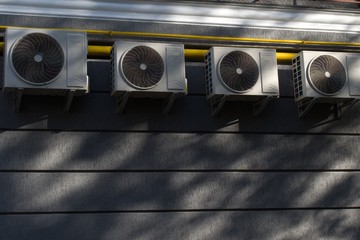 air conditioners on the wall of building