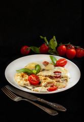 omelet with fresh small red tomatoes