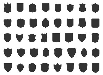 Police badge shape. 40 icons Vector military shield silhouettes. Security patches isolated on white background. Illustration shield shape protection, black security and football badge vector - obrazy, fototapety, plakaty