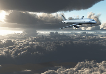 Fototapeta na wymiar Jet Aircraft flying between clouds