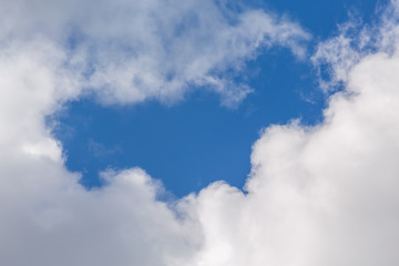 White clouds on a background of blue sky.