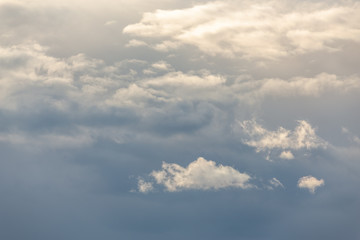 Fototapeta na wymiar Thunderclouds on a gray sky. Beautiful background