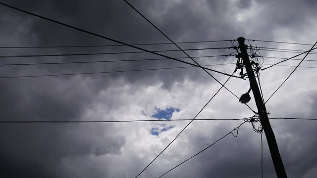 Utility pole and stormy sky time-lapse.