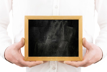 
Man without a head with a black board in his hands on a white background