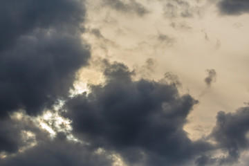 Cloudy clouds covered the evening sun. Sky before the rain