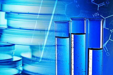 Pills in test tube over blue background.