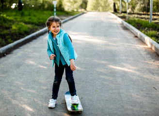 girl skateboarding in spring park