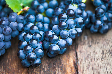 Grape on a wooden barrel. Macro image.