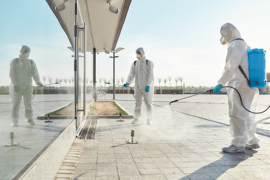 Extreme Cleaning Solutions. Sanitization, cleaning and disinfection of the city due to the emergence of the Covid19 virus. Specialized team in protective suits and masks at work