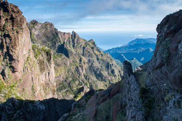 Panorama of the rugged hills in the hiking trail between Pico Ruivo and Pico do Arieiro, Madeira