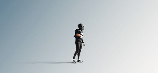 Naklejka na ściany i meble Black silhouette of a male american football player on a uniform background