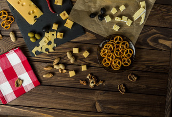 Brie cheese Maasdamer cheese. diced cheese on a cheese platter, nuts