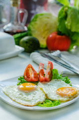 Fried eggs from two eggs on a plate