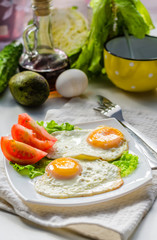 Fried eggs from two eggs on a plate