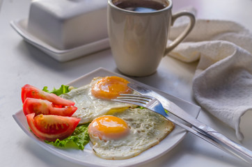 Fried eggs from two eggs on a plate