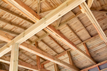 The roof is made of wooden boards. Lumber construction work