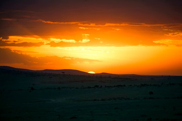 Fototapeta na wymiar Beautiful sunset on a safari in Masai Mara, Africa 