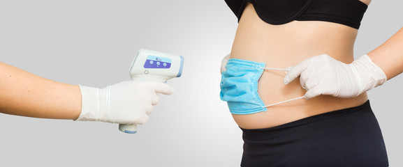 measuring a pregnant woman's temperature with a wireless thermometer