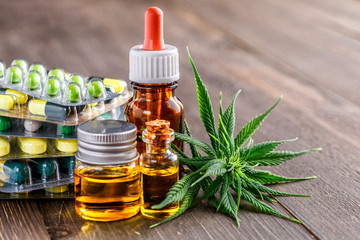 COVID 19 Coronavirus,Green leaves of medicinal cannabis with extract oil.Medical marijuana flower buds. Hemp buds - medical marijuana concept